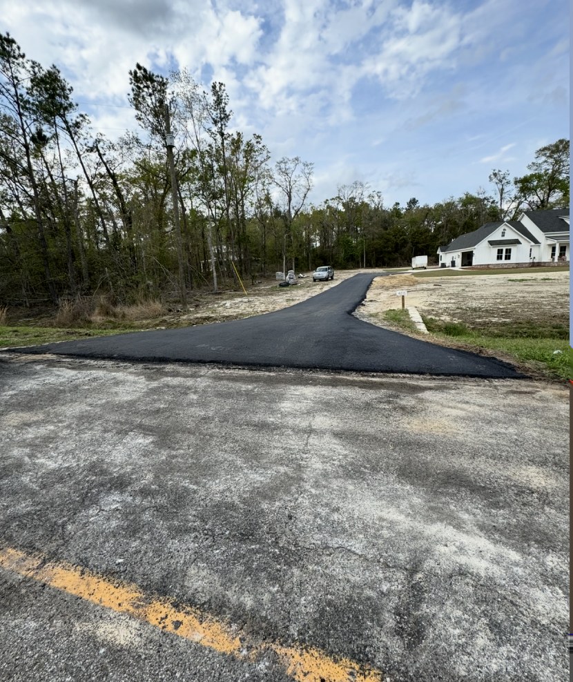 Freshly paved rural asphalt driveway completed by DC Hot Mix